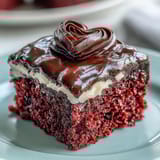 The Red Betty Boop Heart Cake stands tall with a dark chocolate silhouette on smooth vanilla frosting. 