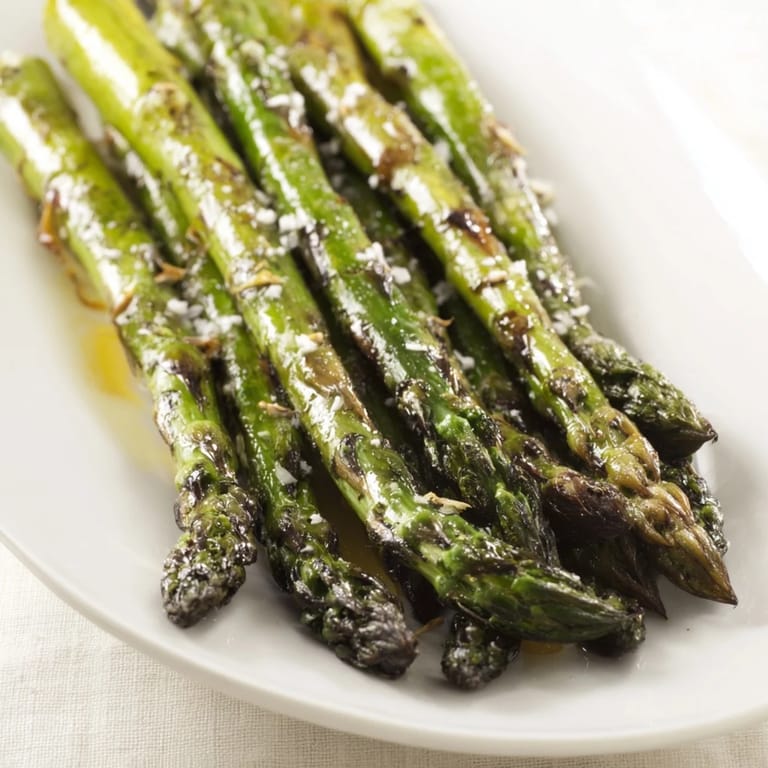 Tender charred Grilled Asparagus served warm as an easy vegan side dish for dinner.
